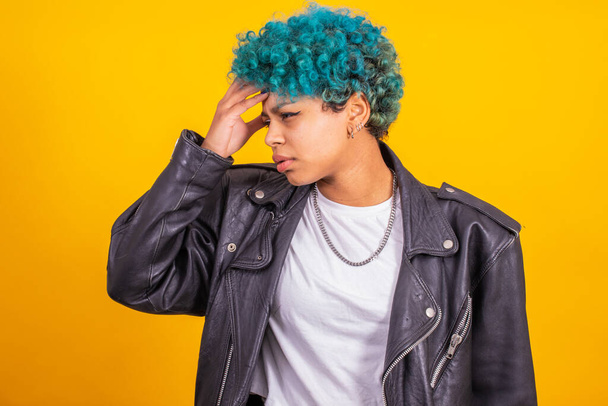 young modern brunette girl with curly blue hair of afro american ethnicity isolated on color background - Fotografie, Obrázek