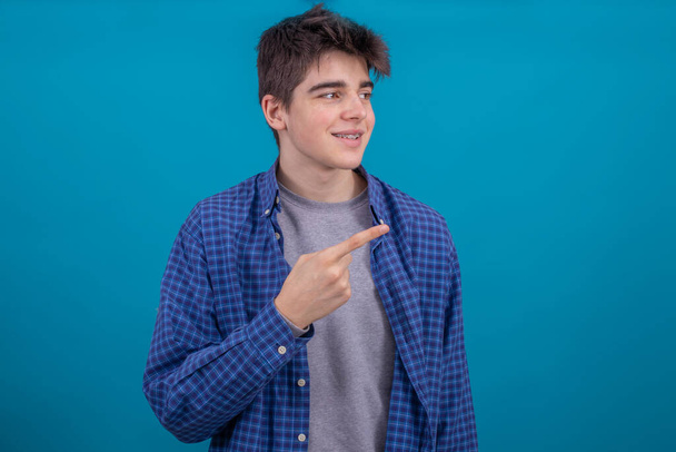 portrait of young casual man or student isolated on color background - Photo, Image