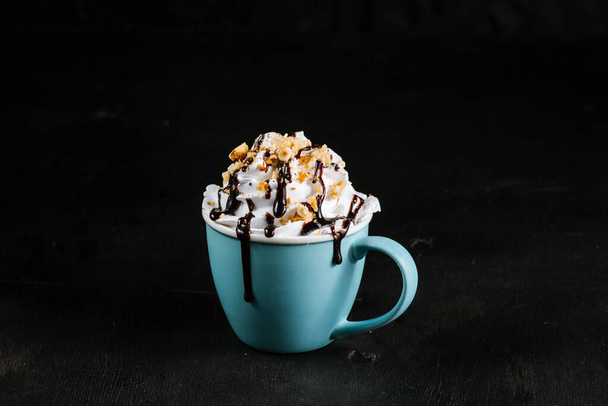 Cup with coffee and creams on black background - Foto, Imagem