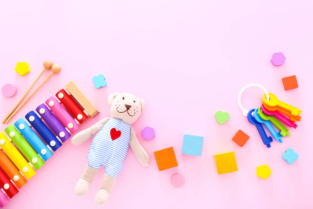Colorful kids toys on pink background. Top view - Photo, Image