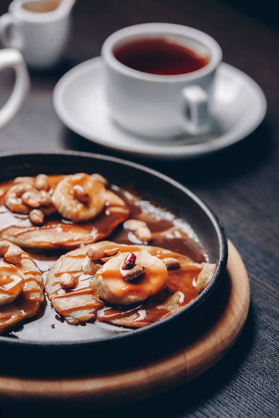 pancakes with peanuts and caramel sauce - 写真・画像