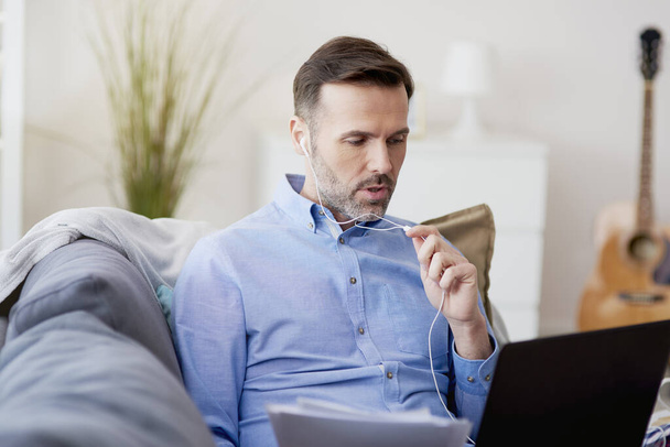 Man having a mobile conversation during home office - Photo, Image