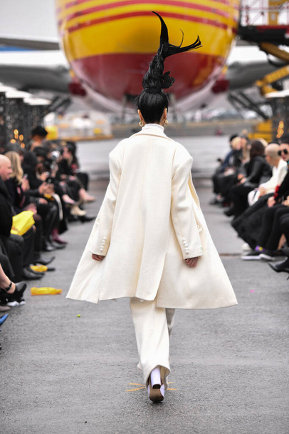 JAMAICA, NEW YORK - FEBRUARY 06: A model walks the runway for RAP during : Jessica Minh Anhs "Runway on Runway" Winter Fashion Show at DHL hub JFK Airport on February 06, 2020 in NY   - Photo, image