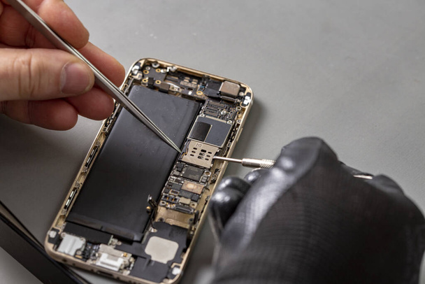 smartphone repair on a work desk - Photo, image