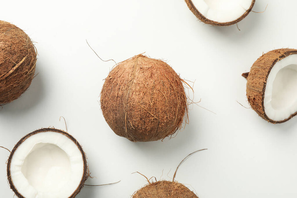 Flat lay with coconut on white background, top view - Foto, Bild