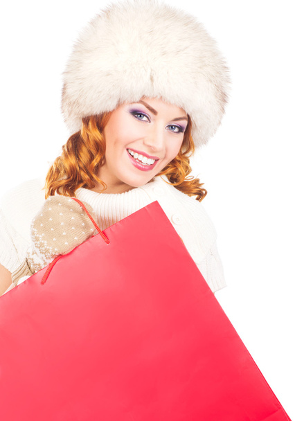 A happy woman posing in warm winter clothes - 写真・画像