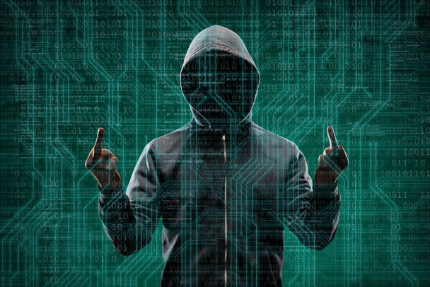 Computer hacker in mask and hoodie over abstract binary background. Obscured dark face. Data thief, internet fraud, darknet and cyber security concept. - Foto, immagini