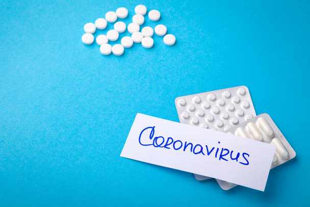 Inscription Coronavirus, blister with pills, concept global crisis, world pandemic - Фото, изображение