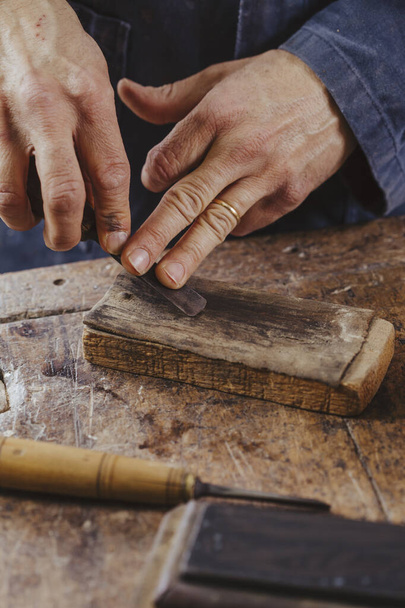 carpenter at work with woodworking tools - Fotó, kép