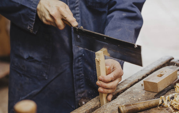 carpenter at work with woodworking tools - 写真・画像
