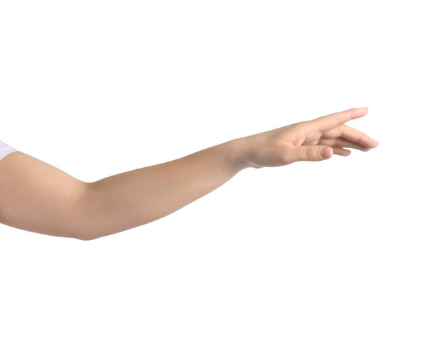 Woman pointing at something against white background, closeup on hand - Photo, image