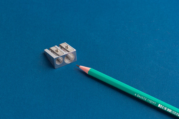 isolated pencils with sharpener on blue background - Foto, imagen