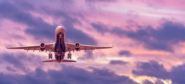 Evening flight, the plane takes off and travels, panoramic view of the sunset sky - Photo, Image