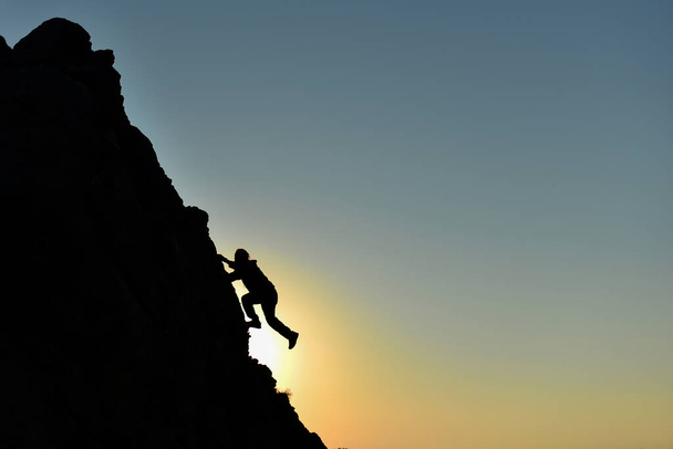 rock climbing striker and climber climbing without equipment - Photo, Image
