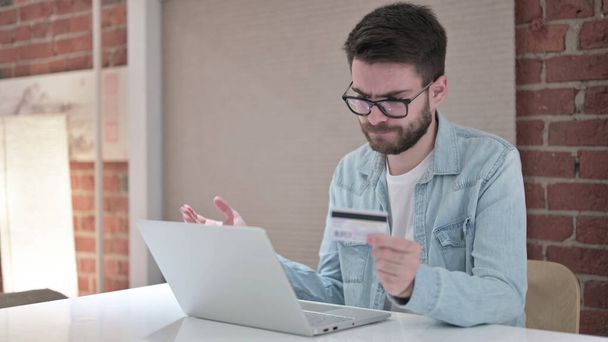 Young Man in Glasses reacting to Online Payment - Photo, Image