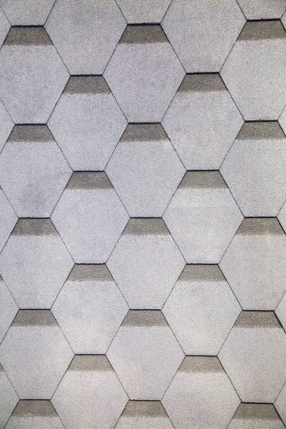 Flexible tiles of gray color with a hexagonal shape. Construction, background, textures, design. - Foto, Imagen