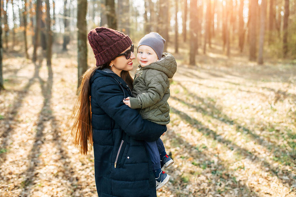 Mother and baby son spend time outdoors together - Photo, Image