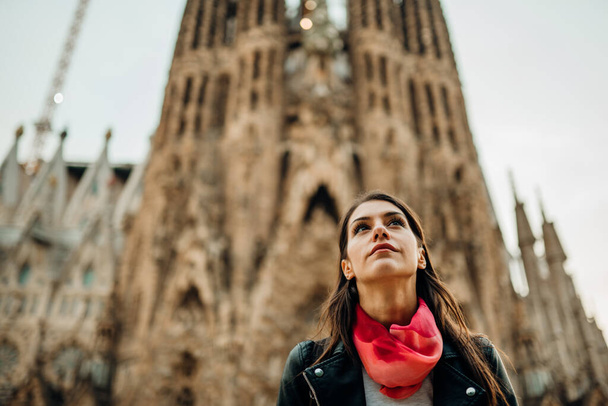Young woman exploring center of Barcelona,Catalonia,Spain.Emotional spanish woman walking.Visiting famous landmarks and attractions.Discovering european cities.Spain travel experience.Tourism in Spain - 写真・画像