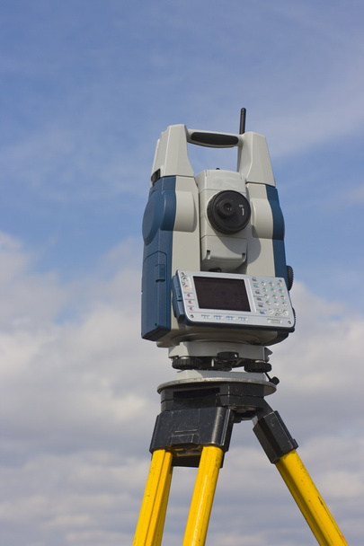 Theodolite against cloudy sky - Photo, Image
