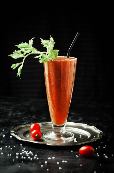 Tomato-celery smoothie with salt on a dark backgroun - Zdjęcie, obraz