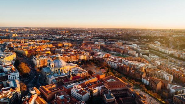 Aerial view of Madrid, vivid La Latina district at sunset. Architecture and landmark of Madrid. Cityscape of Madrid. Neighborhoods in capital city of Spain - Photo, image