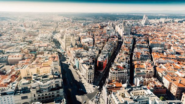 Aerial view of Calle de Alcala and Calle Gran Via.Panoramic aerial view of Gran Via, main shopping street in Madrid, capital of Spain, Europe.Tourist attraction and most famous street. - Foto, Imagen