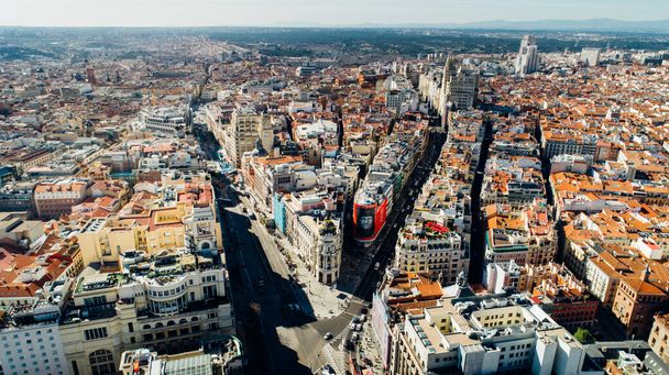 Aerial view of Calle de Alcala and Calle Gran Via.Panoramic aerial view of Gran Via, main shopping street in Madrid, capital of Spain, Europe.Tourist attraction and most famous street. - Foto, Imagem