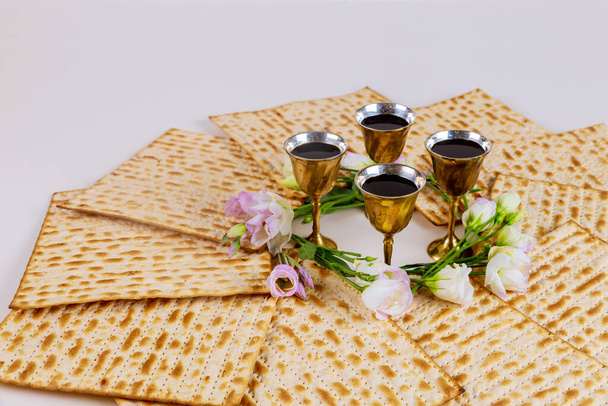 Matzah and four wine cups. Jewish holidays Passover concept. - Photo, Image