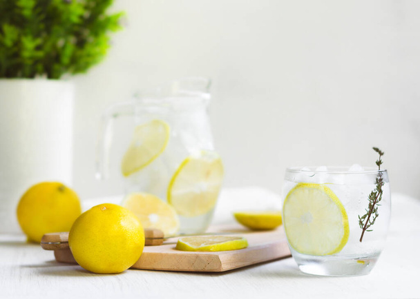 Fresh Sweet Lemonade Water; knife, wood and some plants - Фото, зображення