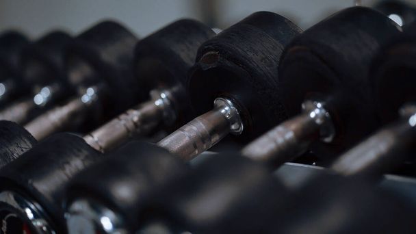 Row of barbells in a gym - Foto, afbeelding