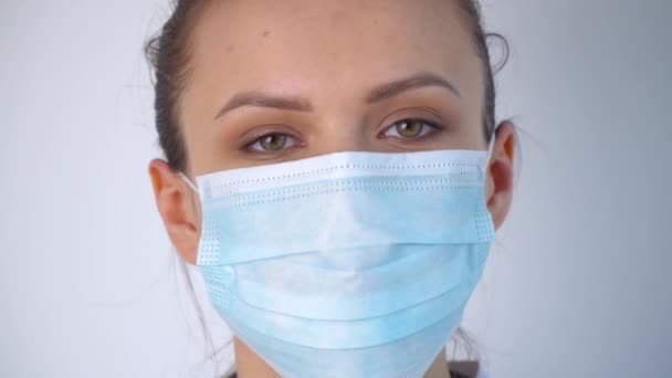 Close up of caucasian doctor in protective mask. Covid-19 protection - Πλάνα, βίντεο