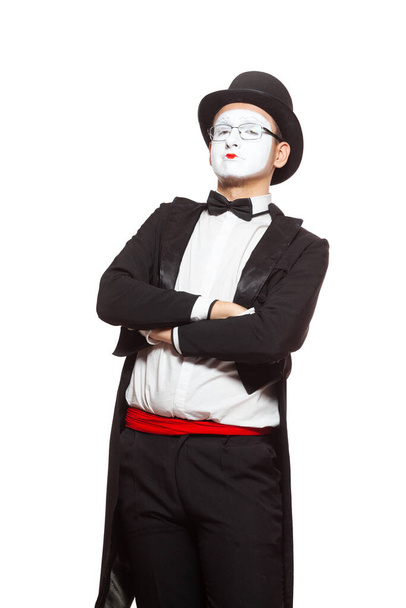 Portrait of a male mime artist performing, isolated on white background. Symbol of superiority, arrogance, pride - Photo, image