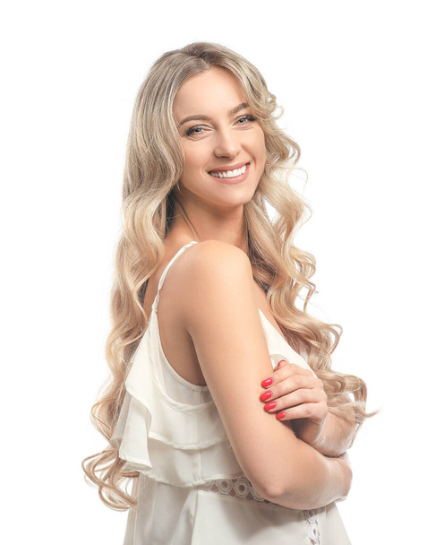 Beautiful young woman with curly hair on white background - Photo, Image