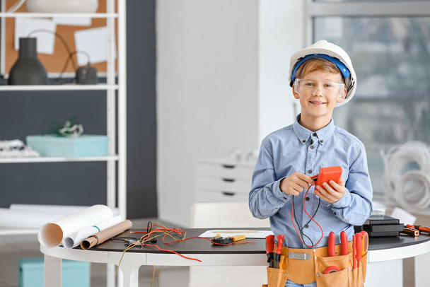 Cute little electrician in room - Photo, Image