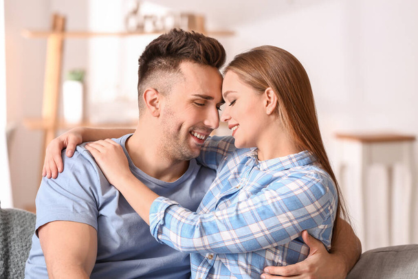Portrait of happy young couple at home - Fotoğraf, Görsel