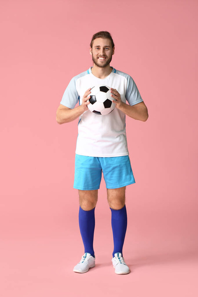Male football player on color background - Zdjęcie, obraz