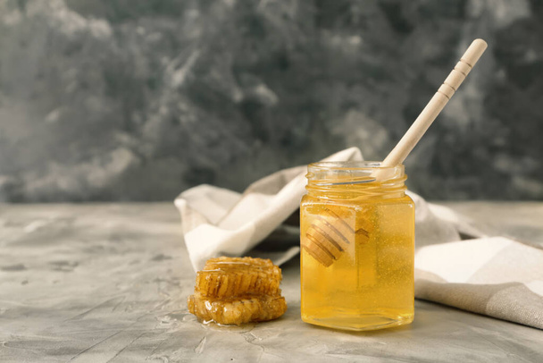 Jar of sweet honey on table - Photo, image