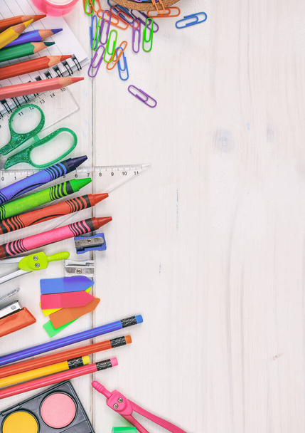 Back to school. School supplies on wood background, top view. Kid creative and education concept. - 写真・画像
