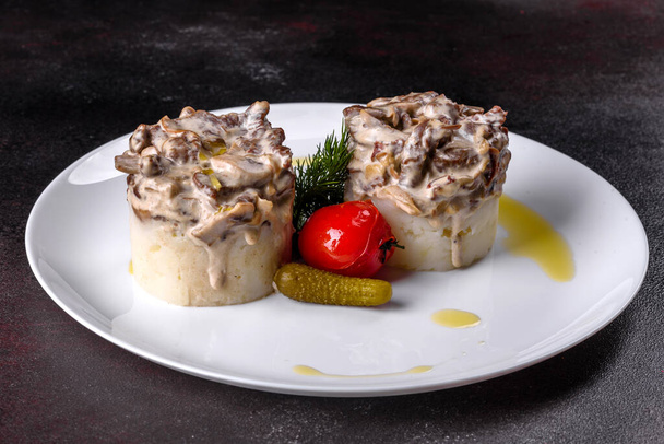 Delicious beef stroganoff with soft mashed potatoes. Beef stroganoff served with potato - Photo, Image