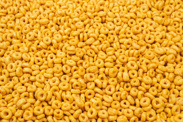 Corn-flakes background and texture. Top view. Honey rings cereal box for morning breakfast. - Photo, Image