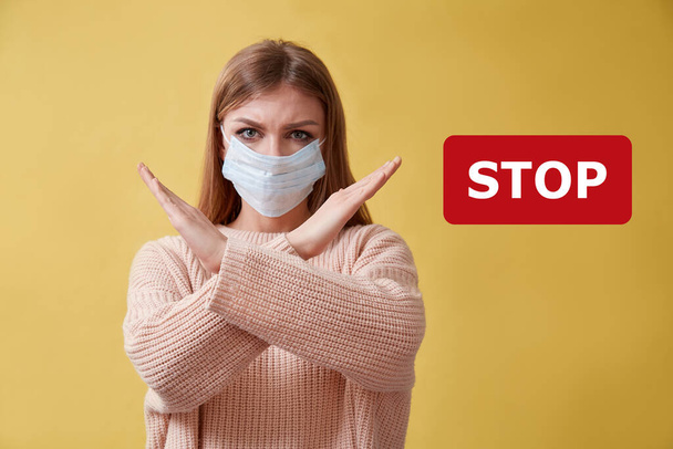 Stop pandemia. No coronavirus. Coronavirus outbreak. Viral infection. Stop inscription. Seasonal viruses. Woman in mask - Fotografie, Obrázek