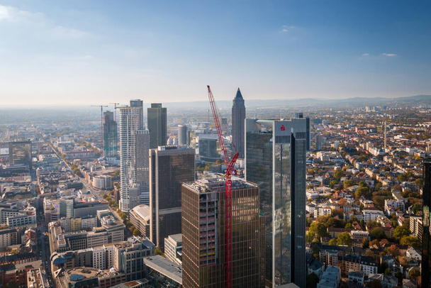 Frankfurt am Main, Germany - October 21, 2018: Aerial panorama cityscape with buildings of financial district such as Trianon (Sparkasse), Westend Tower and Messeturm (Trade Fair Tower) - Fotó, kép
