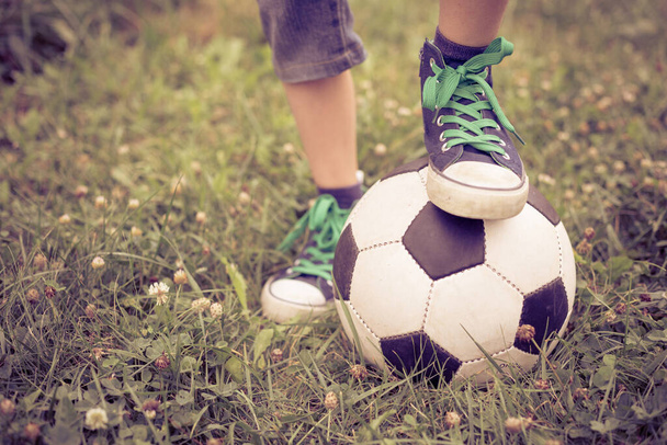 Young little boy standing  with soccer ball. Concept of sport. - Fotoğraf, Görsel