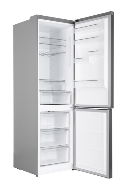 Nieuwe koelkast geïsoleerd op witte achtergrond. Moderne keuken en huishoudelijke grote apparaten - Foto, afbeelding