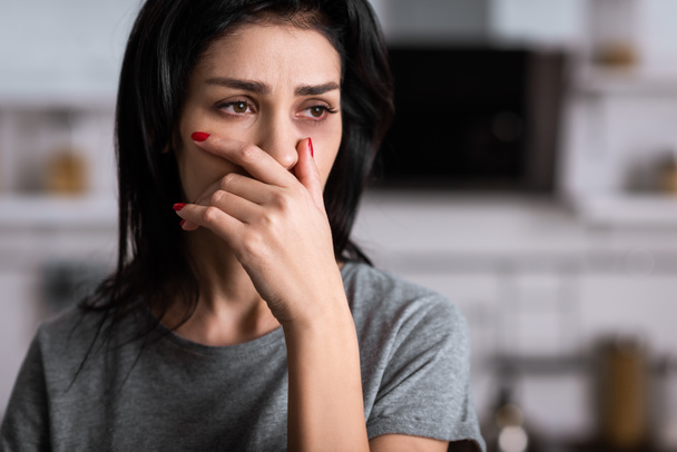 sad and injured woman with bruise covering face, domestic violence concept  - Photo, Image
