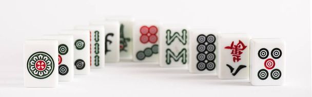 KYIV, UKRAINE - JANUARY 30, 2019: selective focus of mahjong game tiles with signs and characters on white background, panoramic shot - Fotoğraf, Görsel