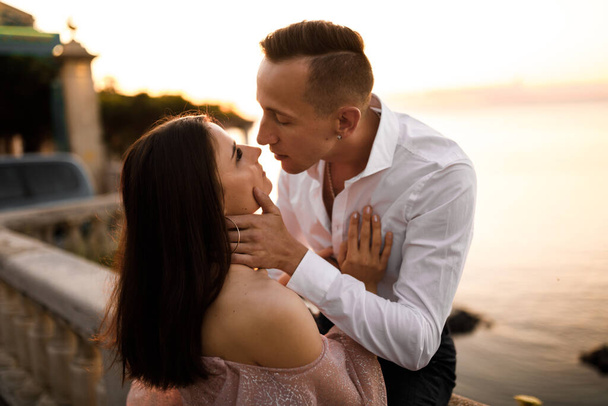 Happy beautiful young  couple kissing  by sea - Fotografie, Obrázek