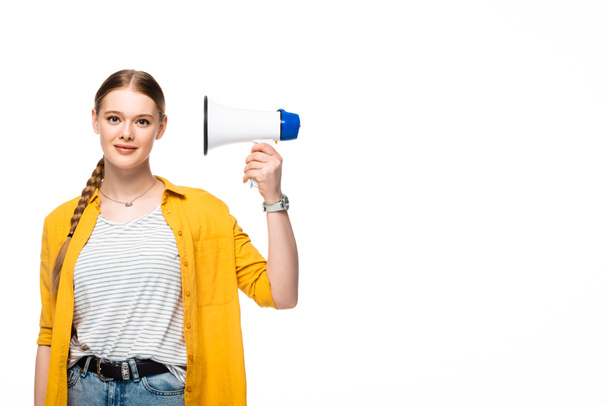 pretty girl with braid holding loudspeaker near ear isolated on white - Foto, afbeelding