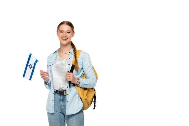 smiling pretty student with backpack holding flag of Israel isolated on white - Photo, Image