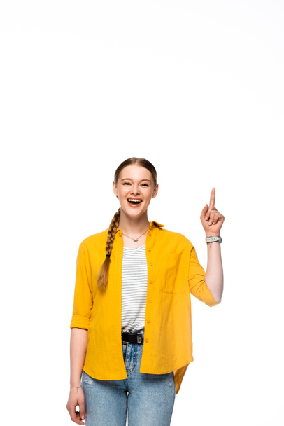 happy attractive girl with braid and open mouth showing idea gesture isolated on white - Φωτογραφία, εικόνα